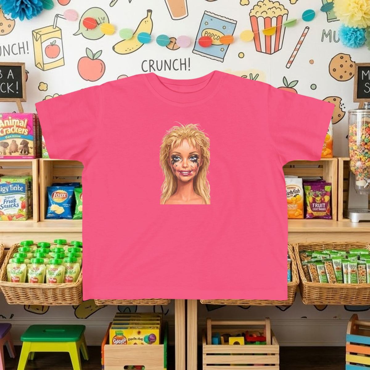 Pink toddler tee with smudged doll face graphic print on front