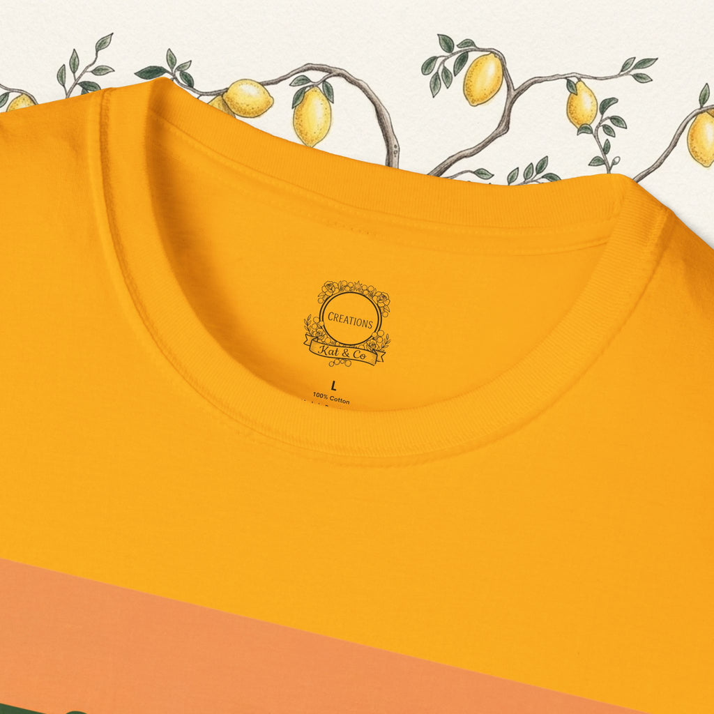 Orange crewneck T-shirt close-up with small chest emblem near neckline