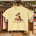 Butter yellow t-shirt with Santa-hat bird and “Merry Christmas!” front graphic