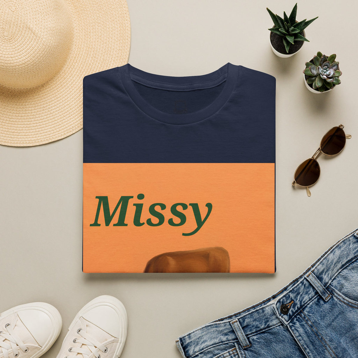 Navy folded cow graphic T-shirt with orange Missy panel and grazing cow