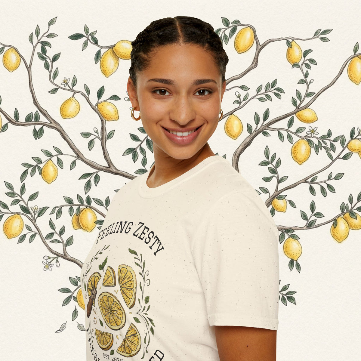 Light cream crew-neck graphic tee showing lemon slice illustration and “FEELING ZESTY”