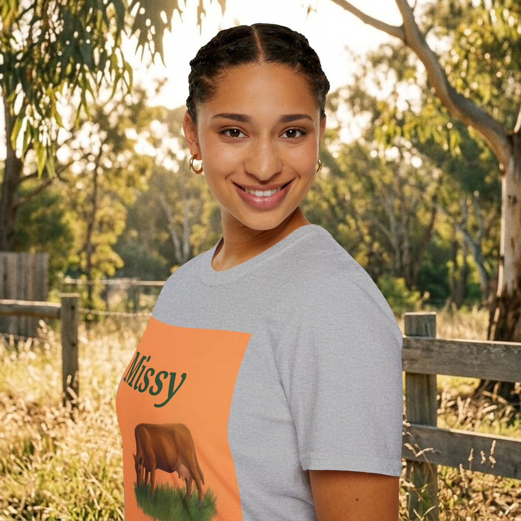 Heather grey T-shirt with orange square cow graphic showing left “Missy” text