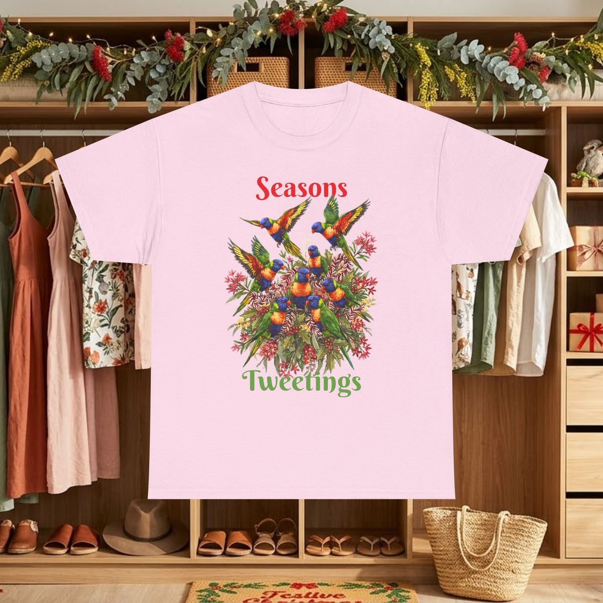 Light pink T-shirt with colorful birds floral graphic and text "Seasons Tweettings"