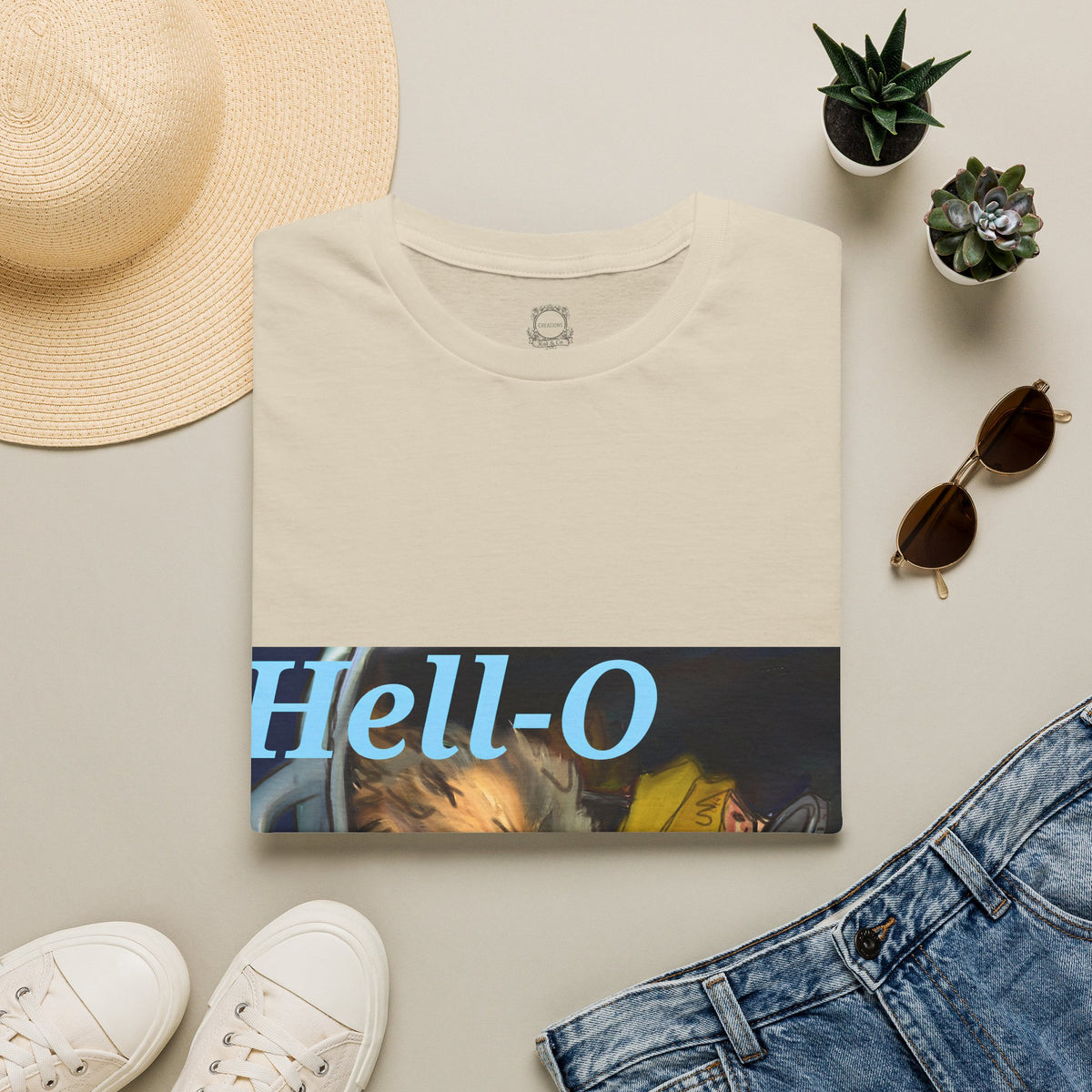 Cream T-shirt with “Hell-O” text and opossum illustration graphic on front