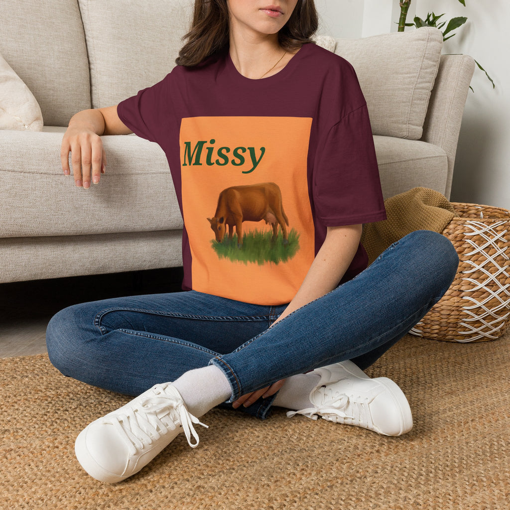 Maroon T-shirt with orange “Missy” graphic panel and grazing cow