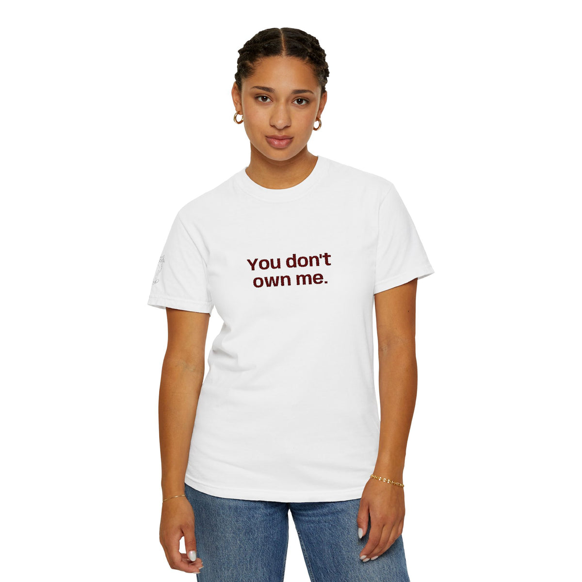 White crewneck T-shirt on a woman with "You don't own me." printed at center.