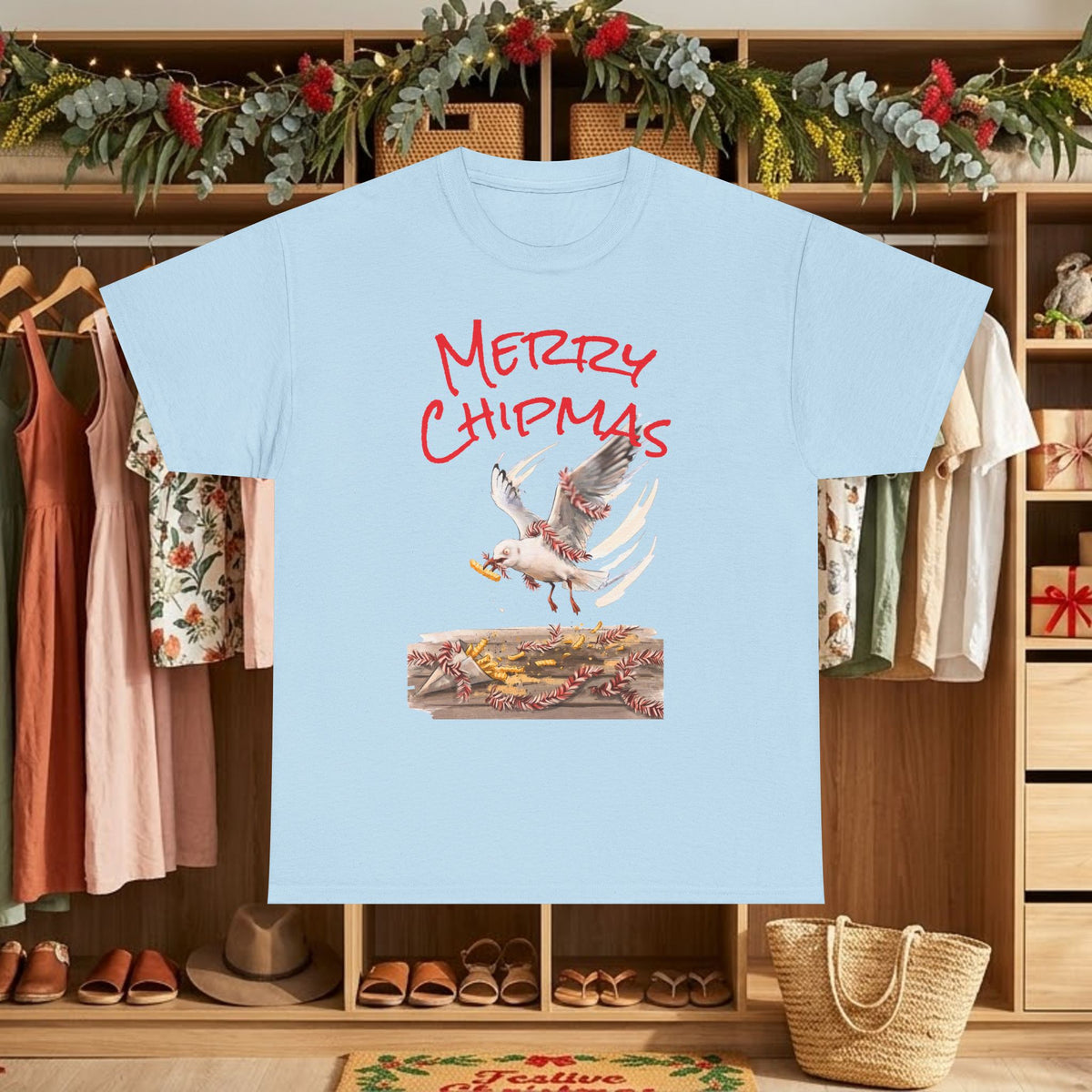 Light blue Christmas graphic T-shirt with "Merry Chipmas" seagull illustration