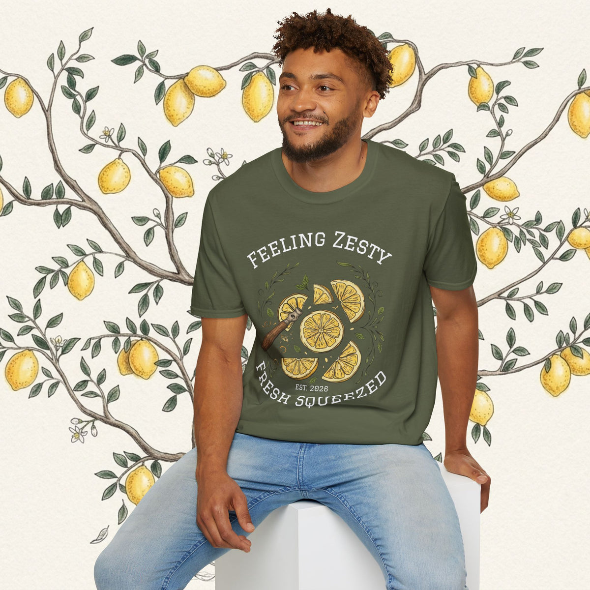 Olive green short-sleeve graphic tee with “FEELING ZESTY” citrus slice illustration