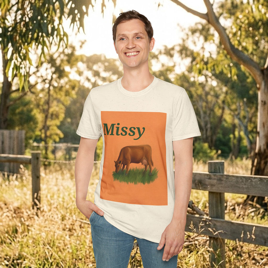 White crew-neck t-shirt with large orange “Missy” grazing cow print on front.