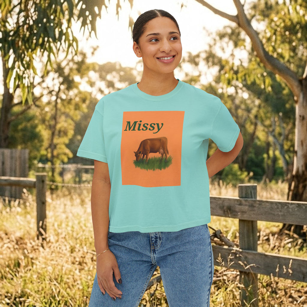Teal boxy crewneck T-shirt with Missy grazing cow graphic on model