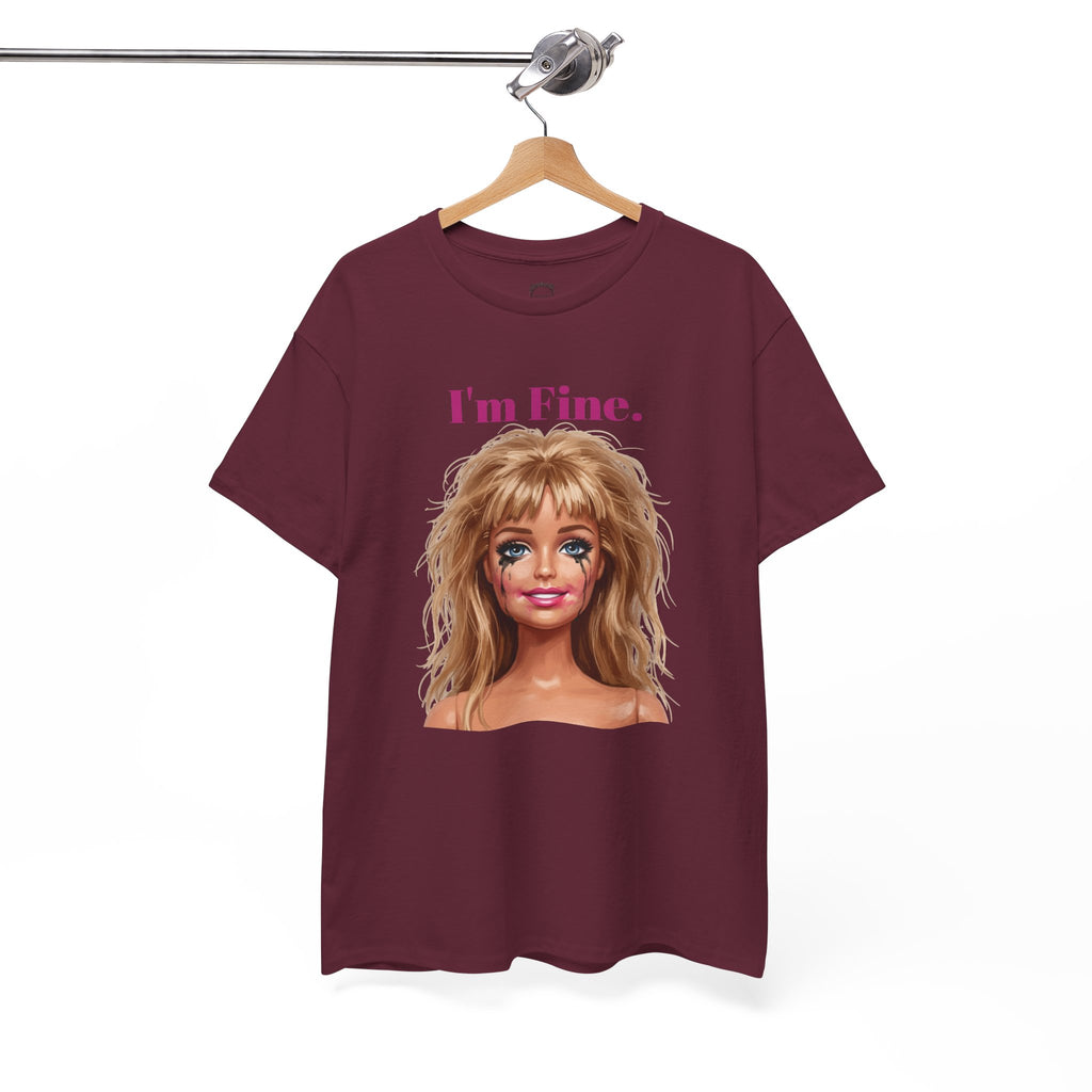 Maroon crewneck T-shirt with doll face graphic and “I’m Fine.” text, hanging on hanger