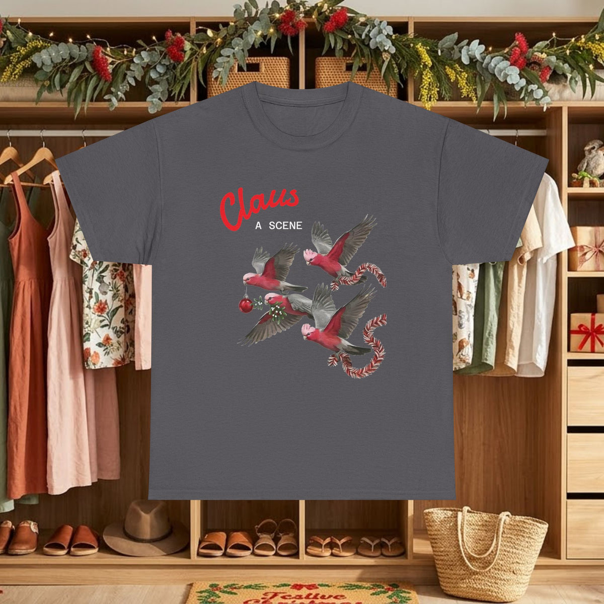 Dark gray Christmas graphic tee with “Claus” text and red flying bird scene