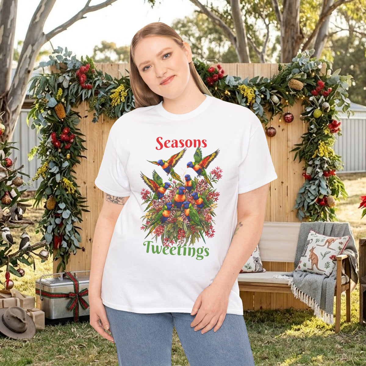 White T-shirt with colorful birds floral holiday graphic and 'Seasons Tweetings' text