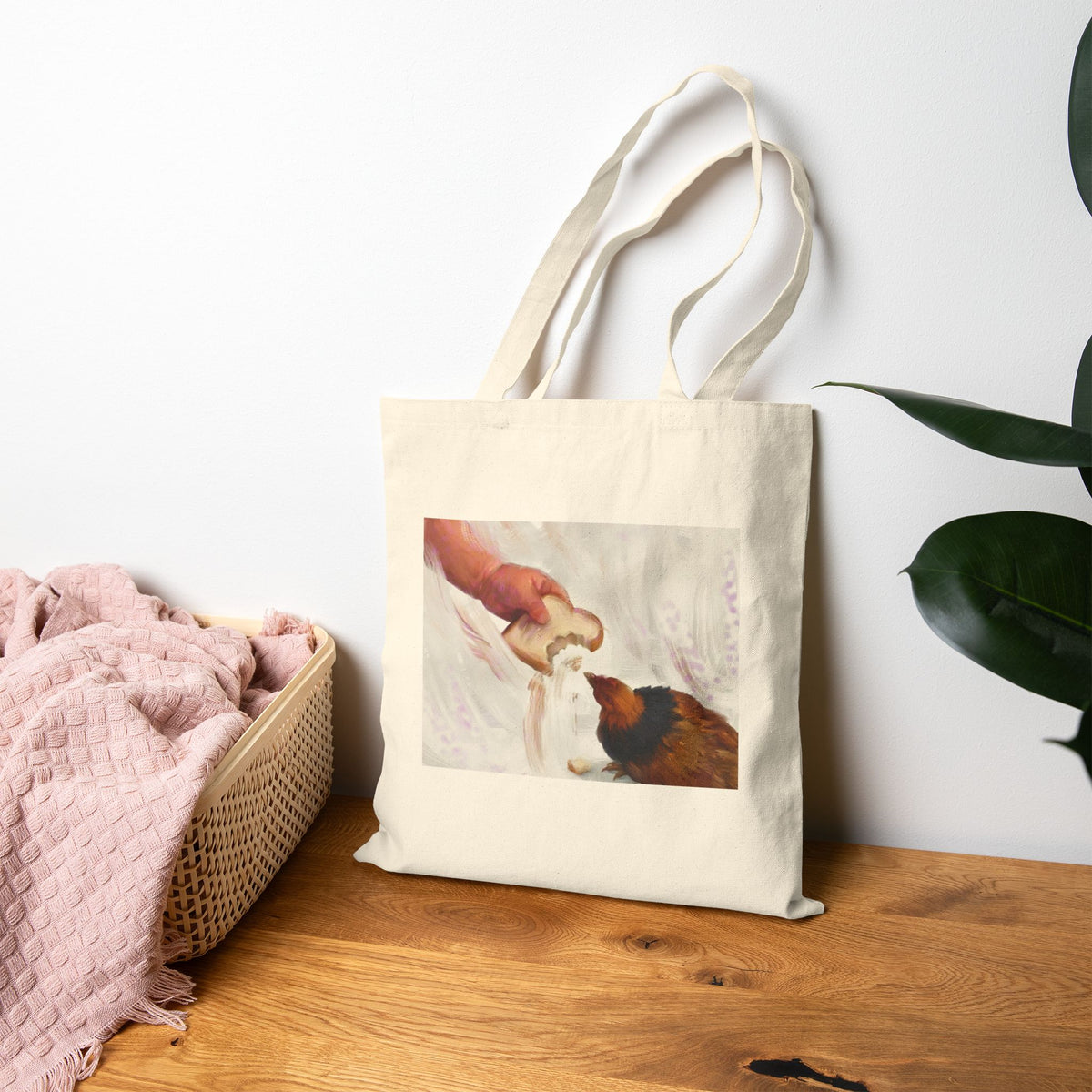 Natural canvas tote bag with vintage hen feeding illustration on the front panel.