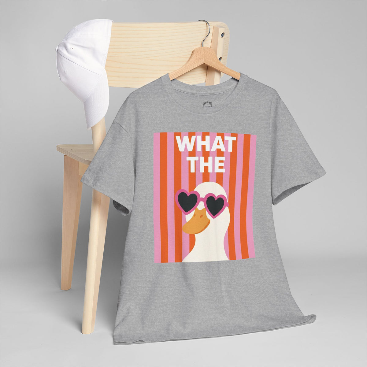 Gray crewneck T-shirt with colorful “WHAT THE” duck graphic and heart sunglasses