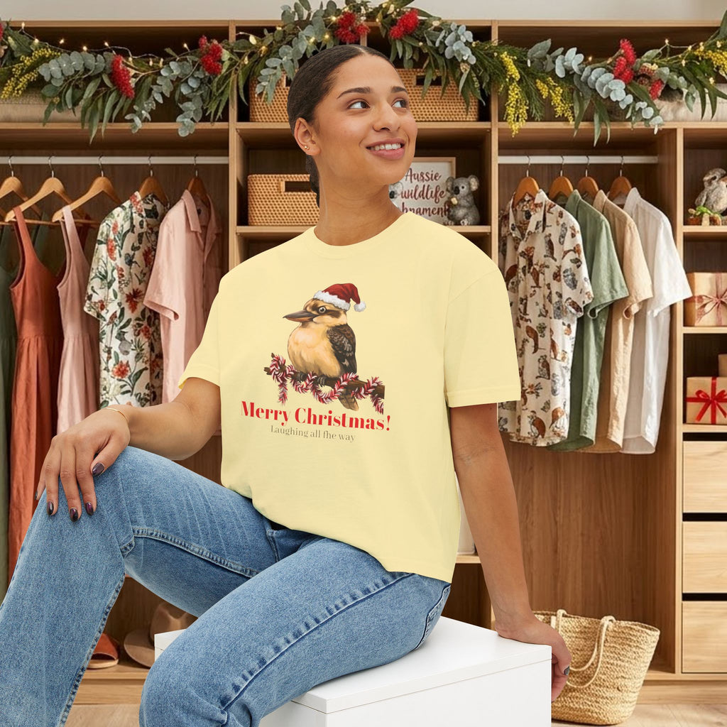 Light yellow short-sleeve crewneck t-shirt with Santa-hat bird graphic and “Merry Christmas”