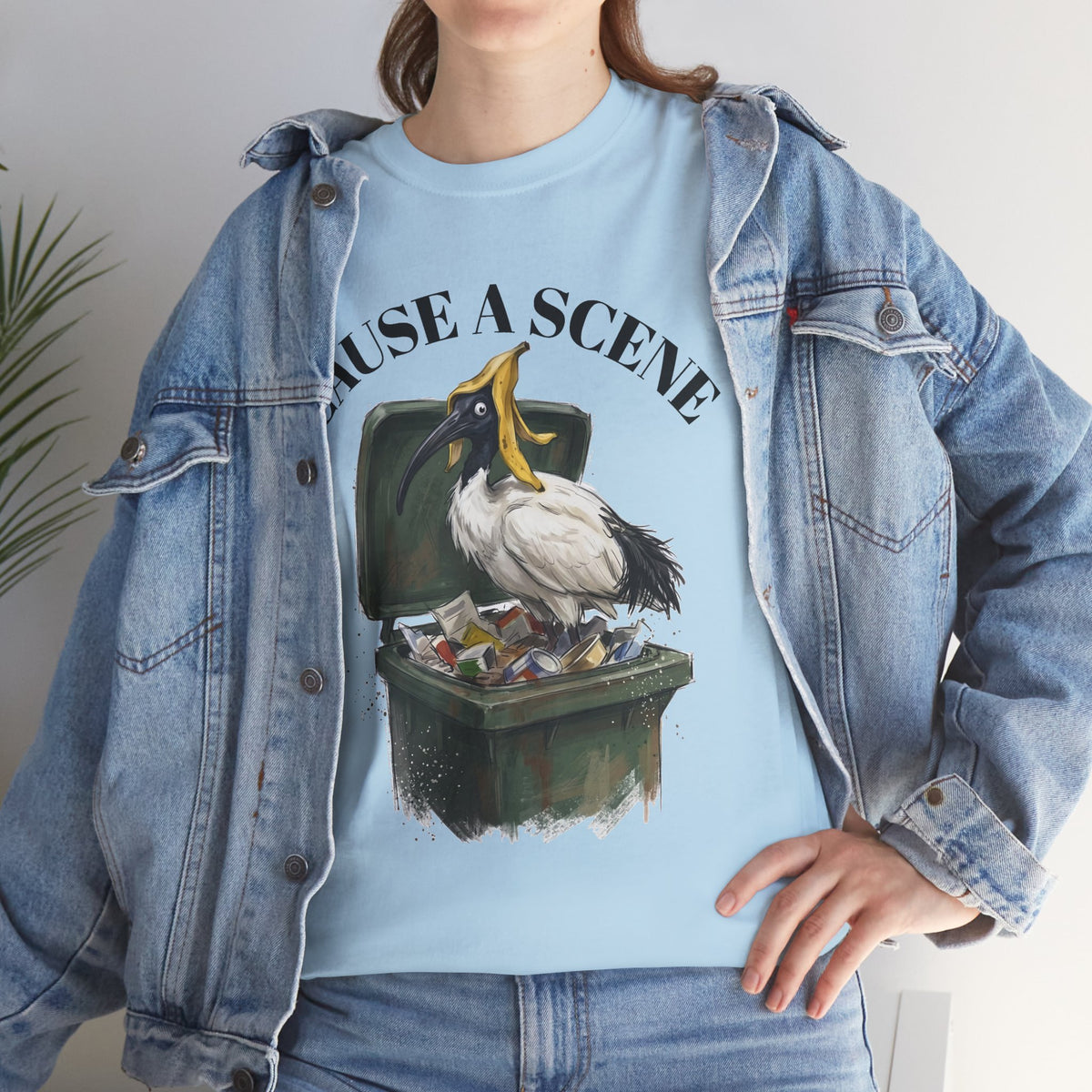 Light blue t-shirt showing “CAUSE A SCENE” ibis trash can graphic