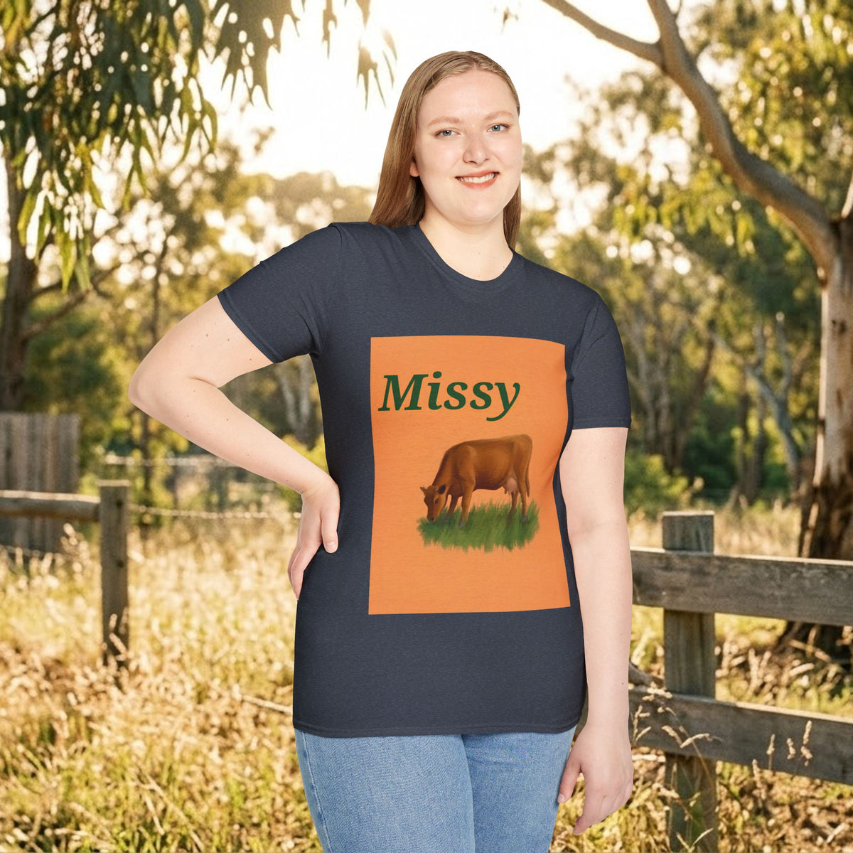 Navy women's t-shirt front view with orange 'Missy' grazing cow graphic