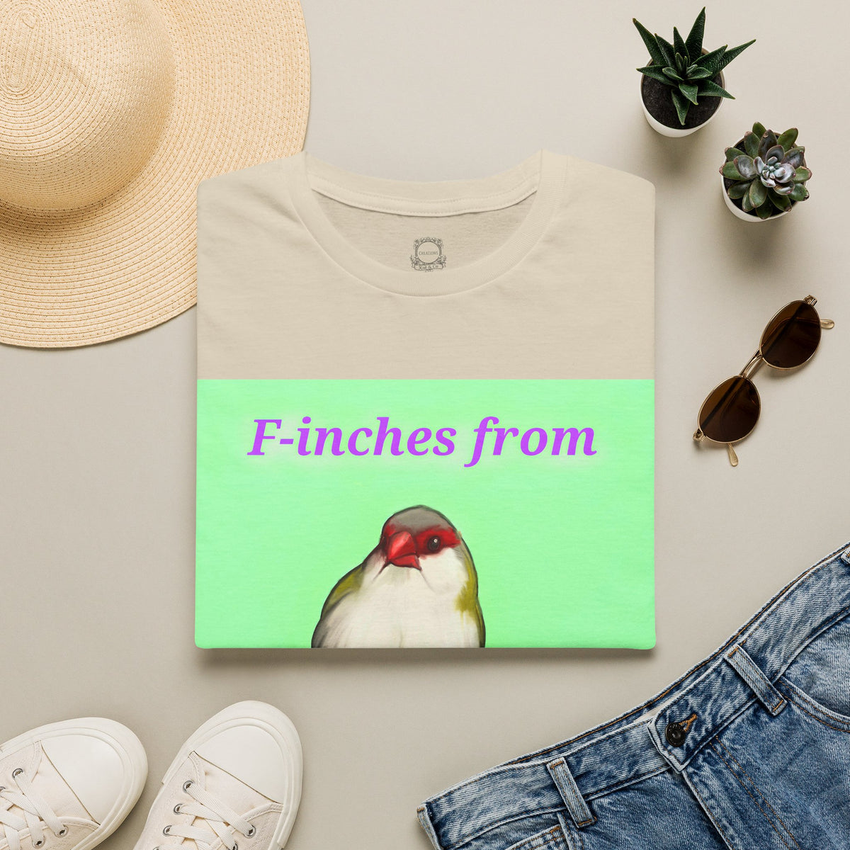 Cream t-shirt with green graphic panel and cute bird illustration print