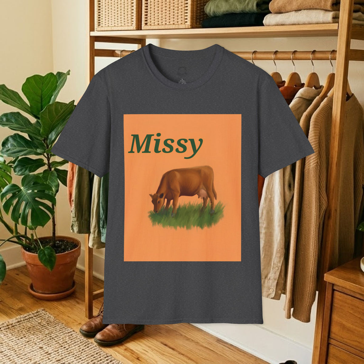 Charcoal gray crew-neck t-shirt with orange square “Missy” grazing cow graphic