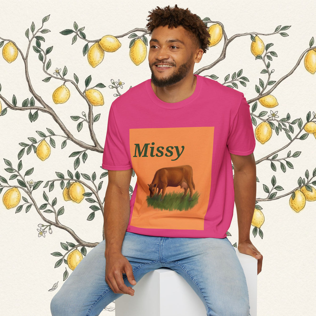 Pink crewneck T-shirt with Missy text and grazing cow graphic on square print