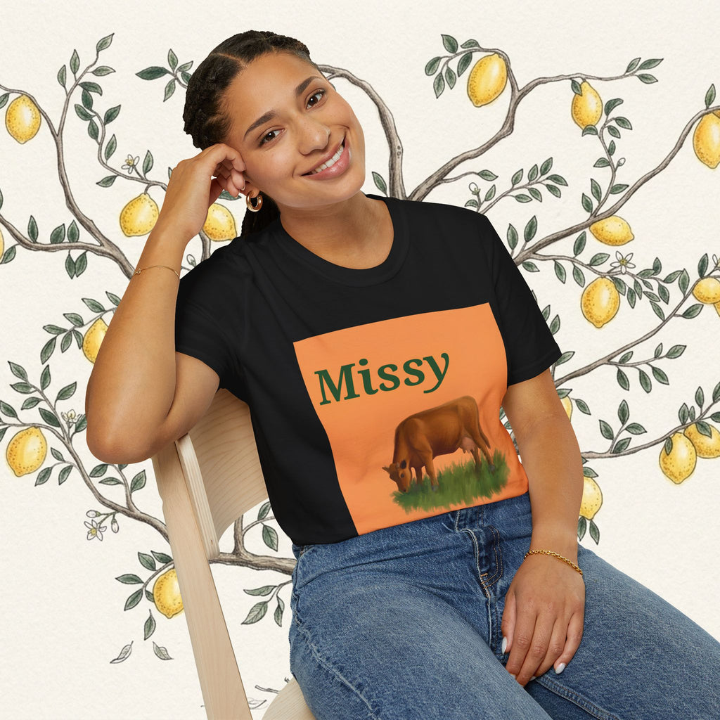 Black short-sleeve T-shirt with orange 'Missy' square featuring grazing cow