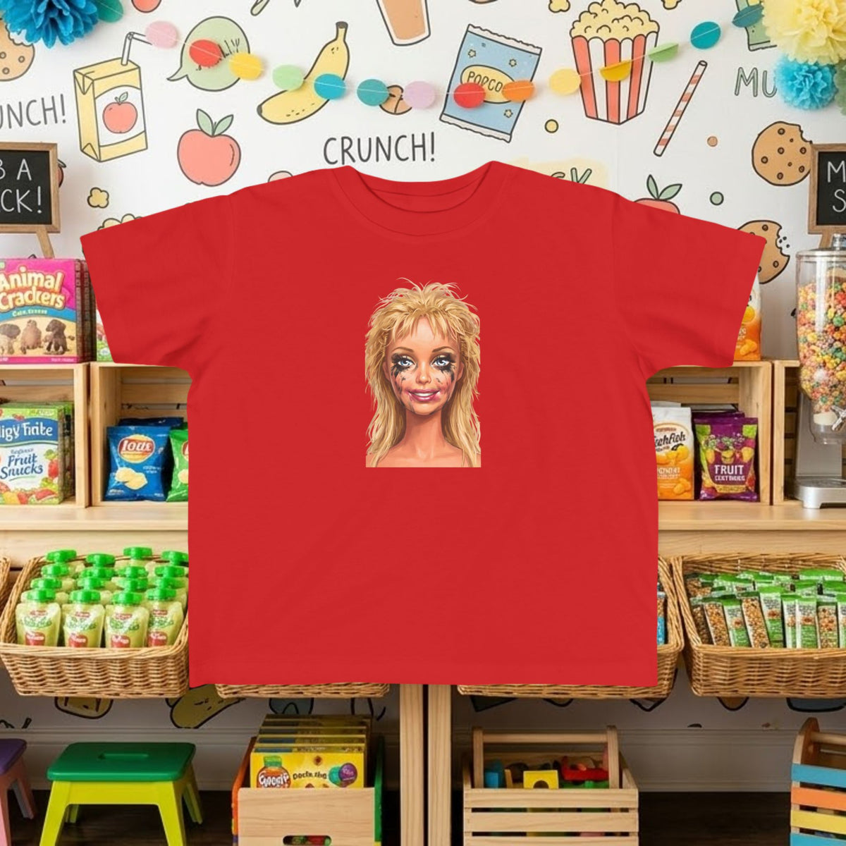 Red toddler tee with smudged doll face graphic print on front