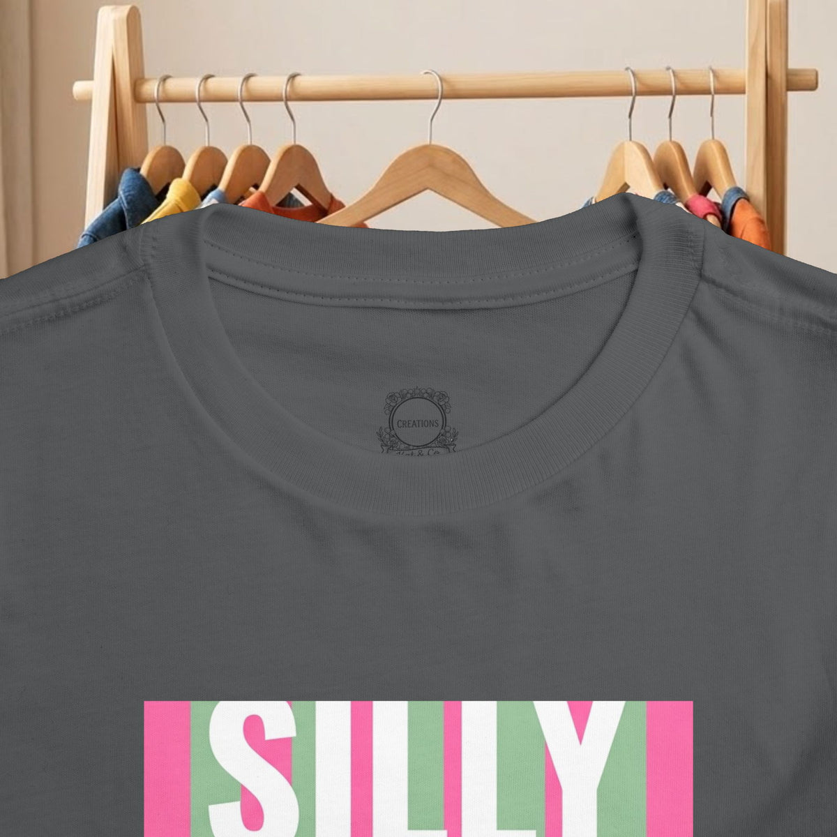 Toddler dark gray tee close-up of logo patch and “SILLY” graphic front print