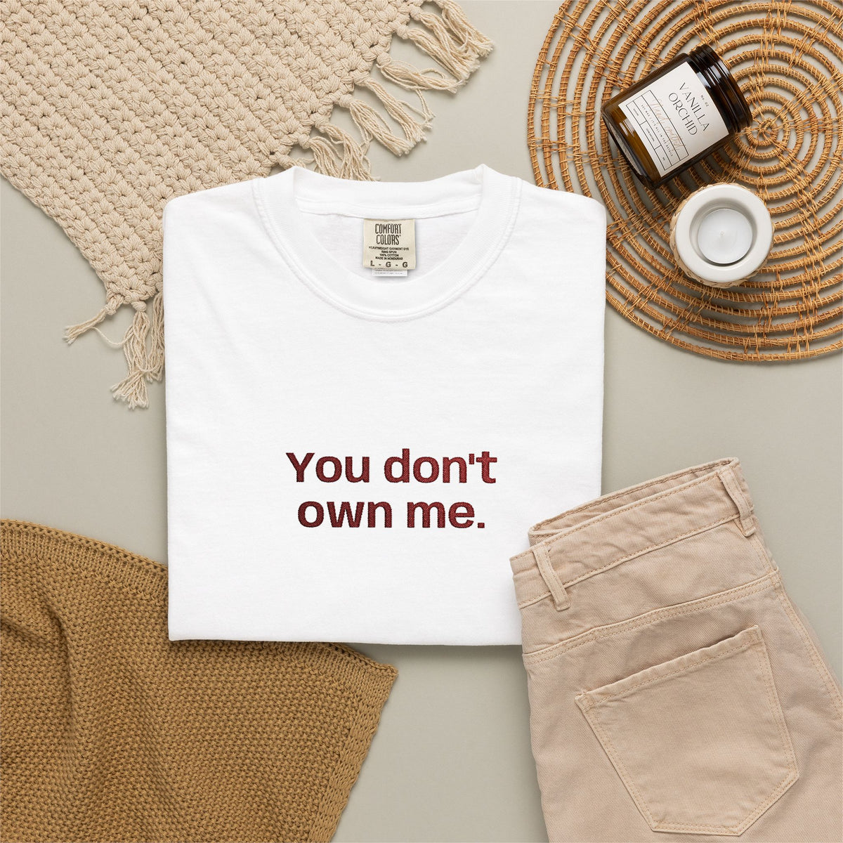 Off-white graphic T-shirt with bold text "You don't own me." on the front.