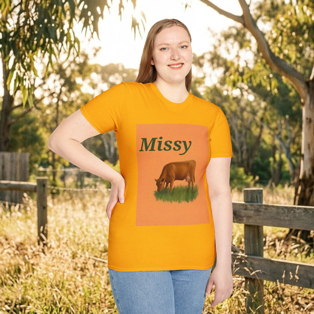 Orange crewneck T-shirt with Missy cow graphic outdoors on female model