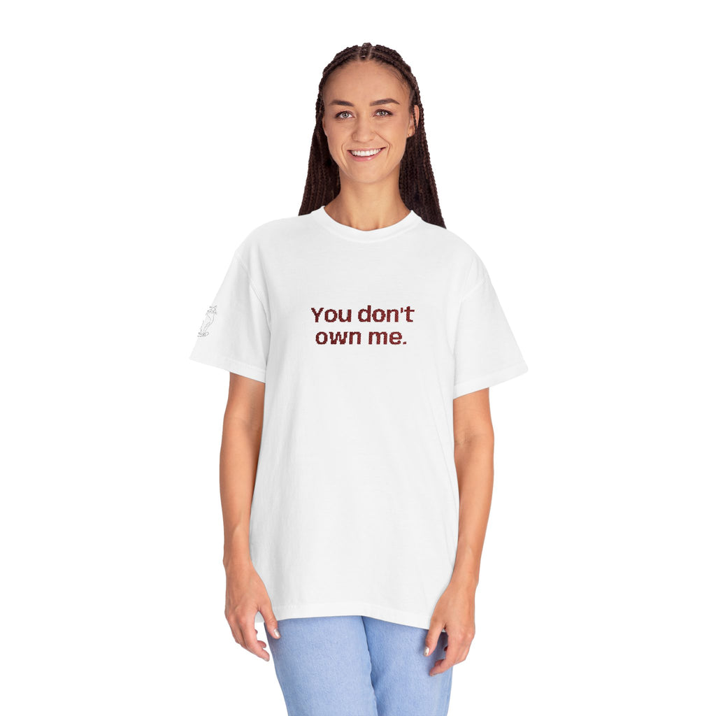 White T-shirt on a woman with "You don't own me." printed on the chest.