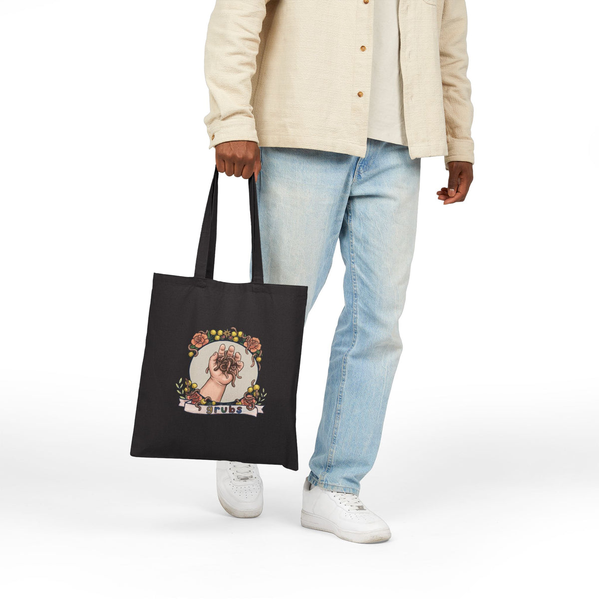 Black canvas tote bag with colorful circular hand-holding-grubs illustration