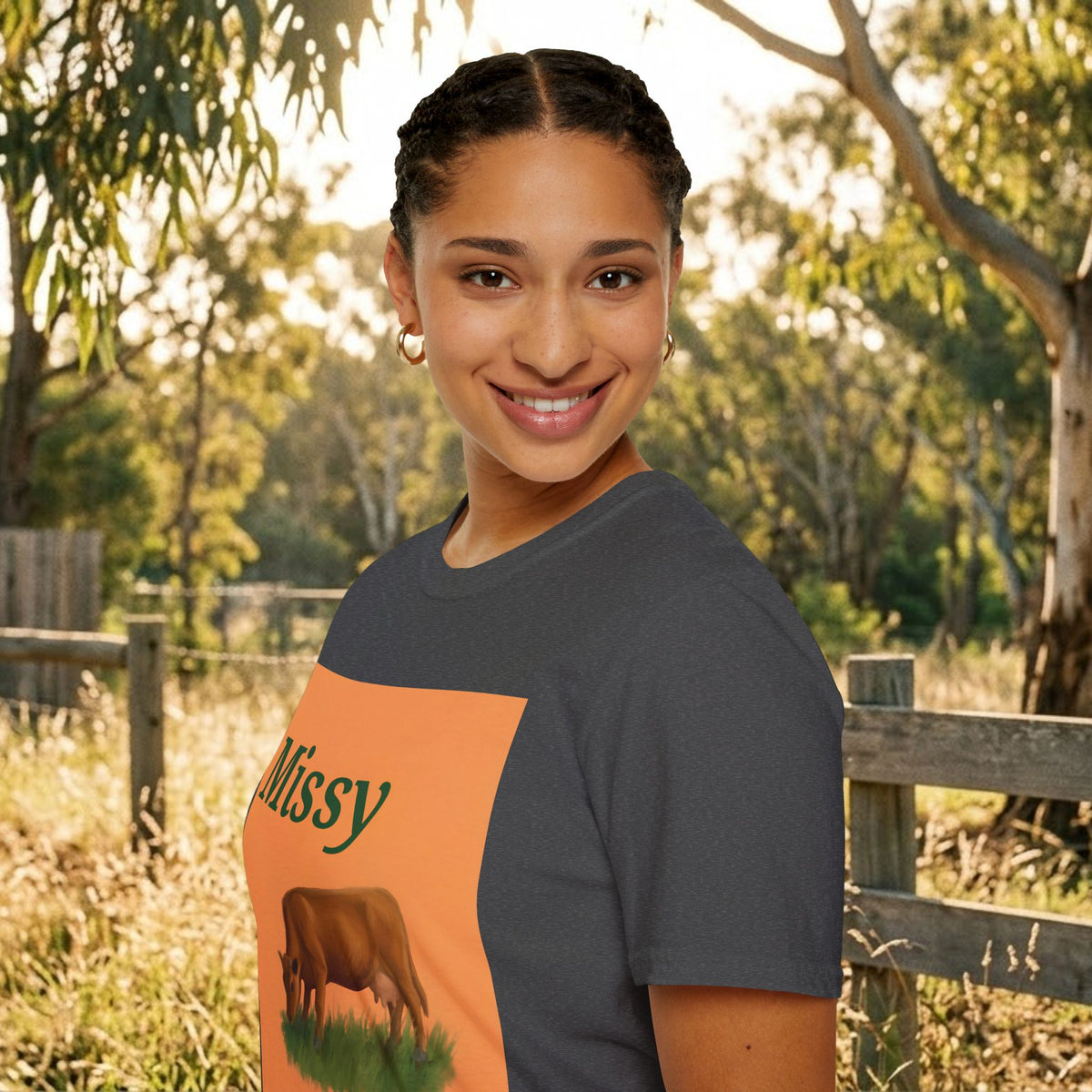 Charcoal T-shirt showing orange “Missy” graphic panel with cow