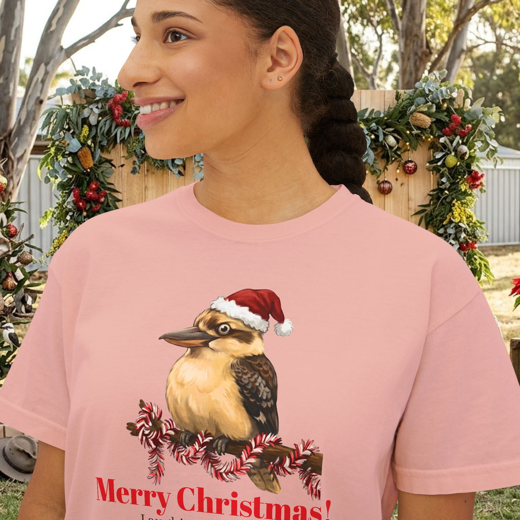 Pink crew-neck t-shirt featuring kookaburra with Santa hat and wreath graphic