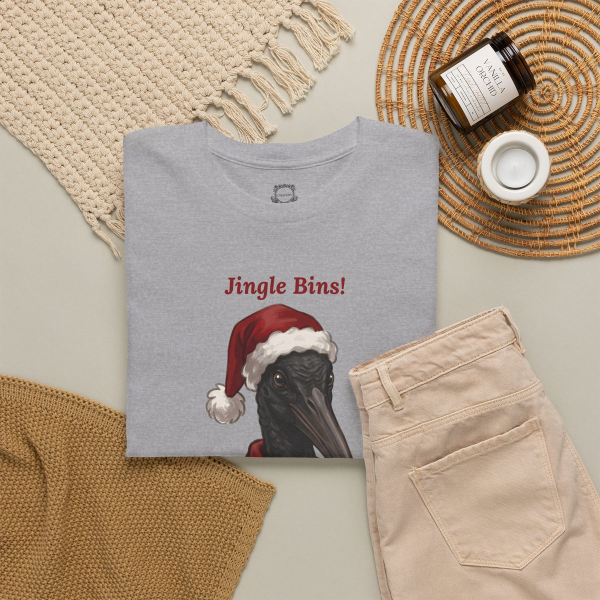 Gray crewneck t-shirt with “Jingle Bins!” text and Santa bird graphic
