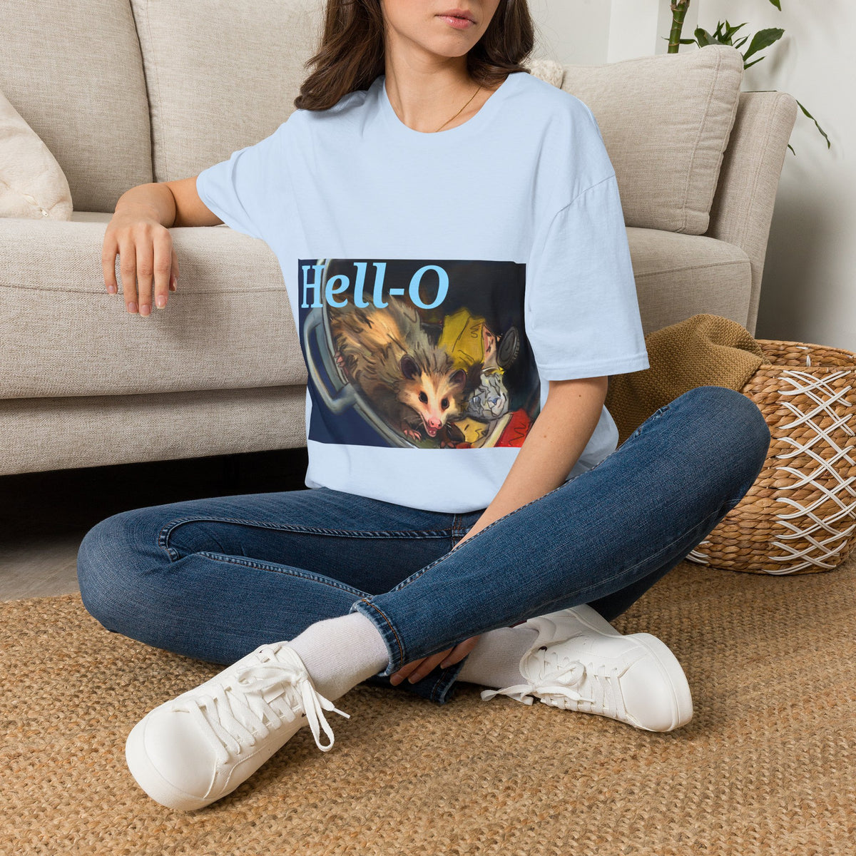 Light blue T-shirt with “Hell-O” text and opossum illustration graphic on front