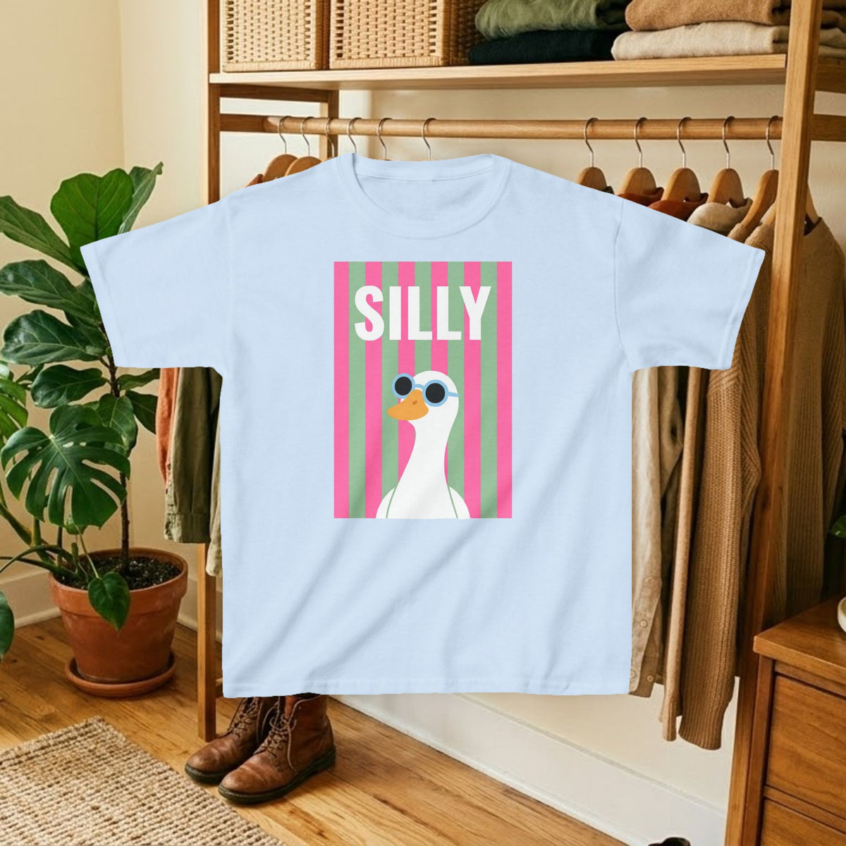 Light blue kids T-shirt with pink striped “SILLY” duck graphic print on the front