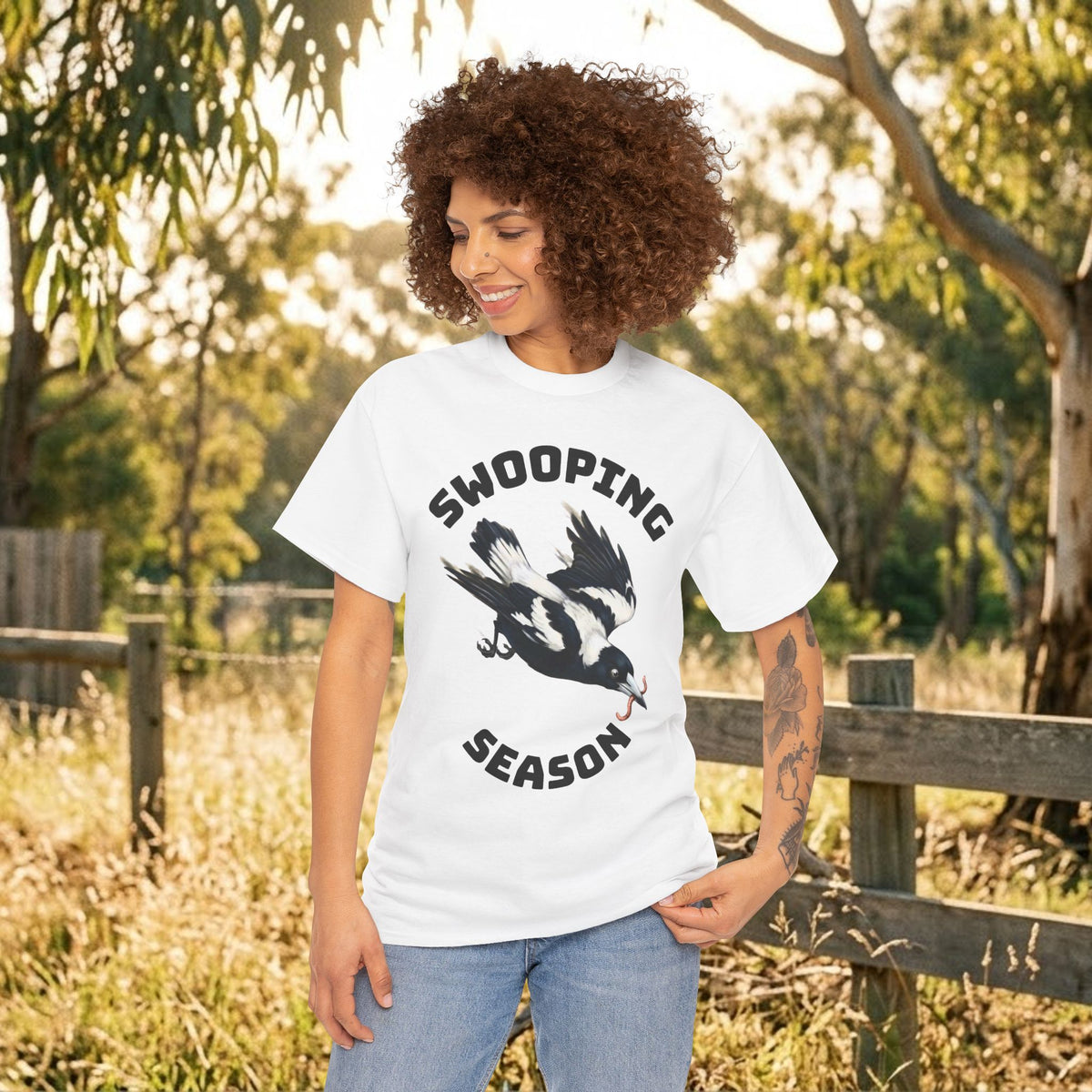 White bird graphic t-shirt with swooping bird and stacked bold text design