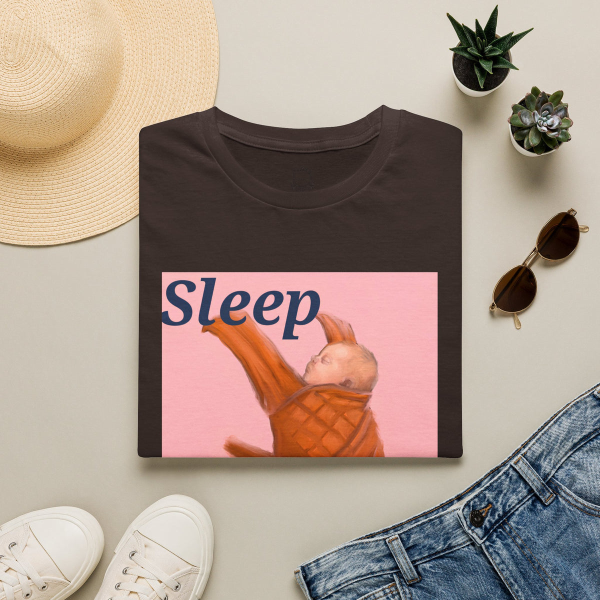 Dark brown t-shirt with “Sleep” sleeping baby graphic