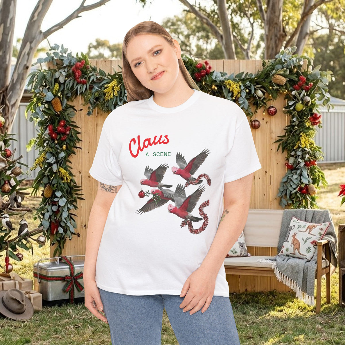 White Christmas T-shirt with “Claus” text and red bird graphic on chest