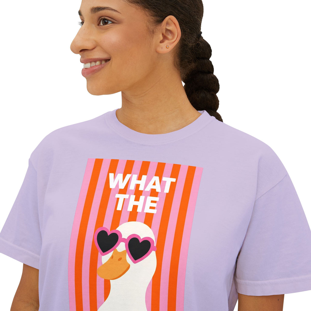 Lavender crew-neck graphic tee with “WHAT THE” text and duck wearing heart glasses