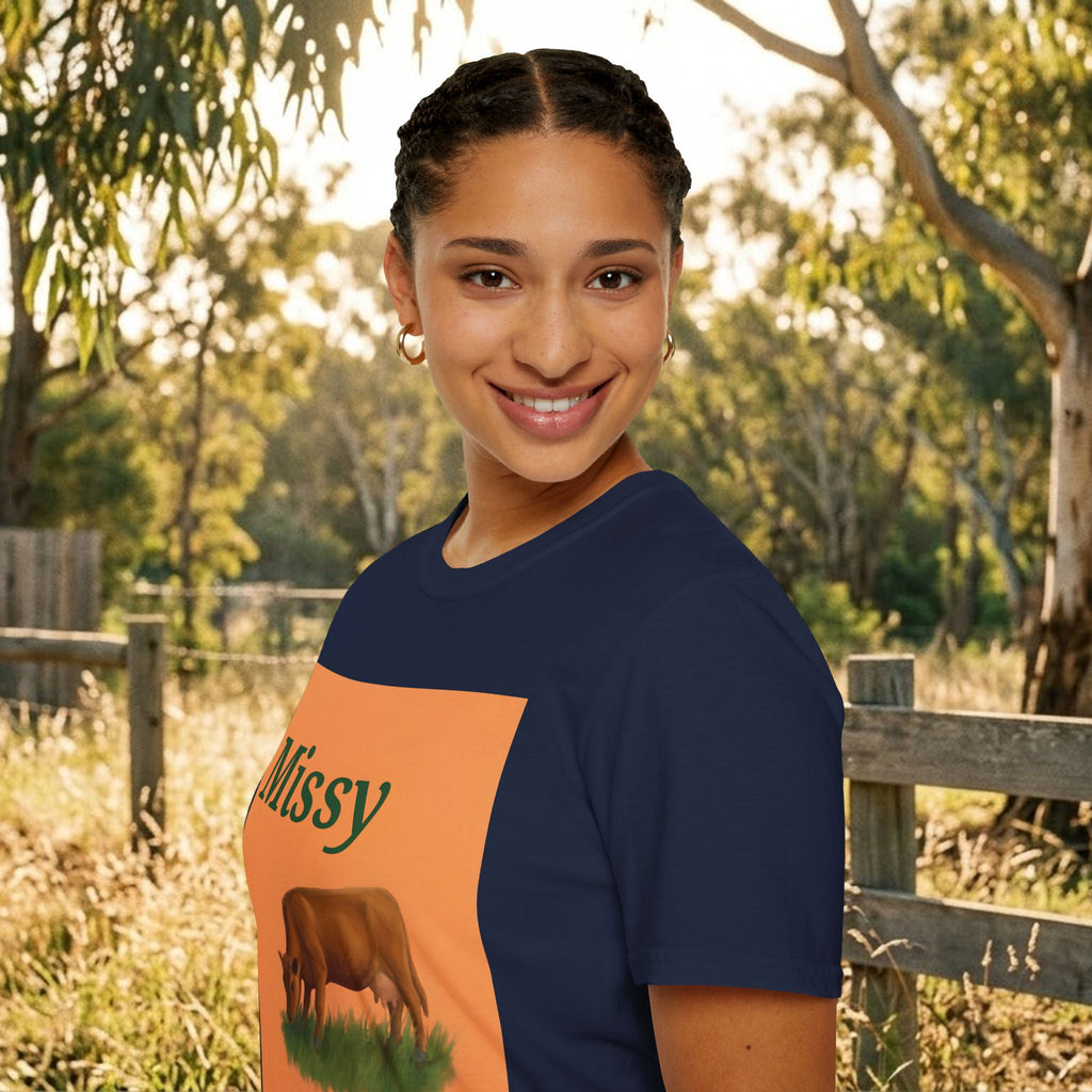 Navy t-shirt side view with 'Missy' orange panel and brown grazing cow graphic