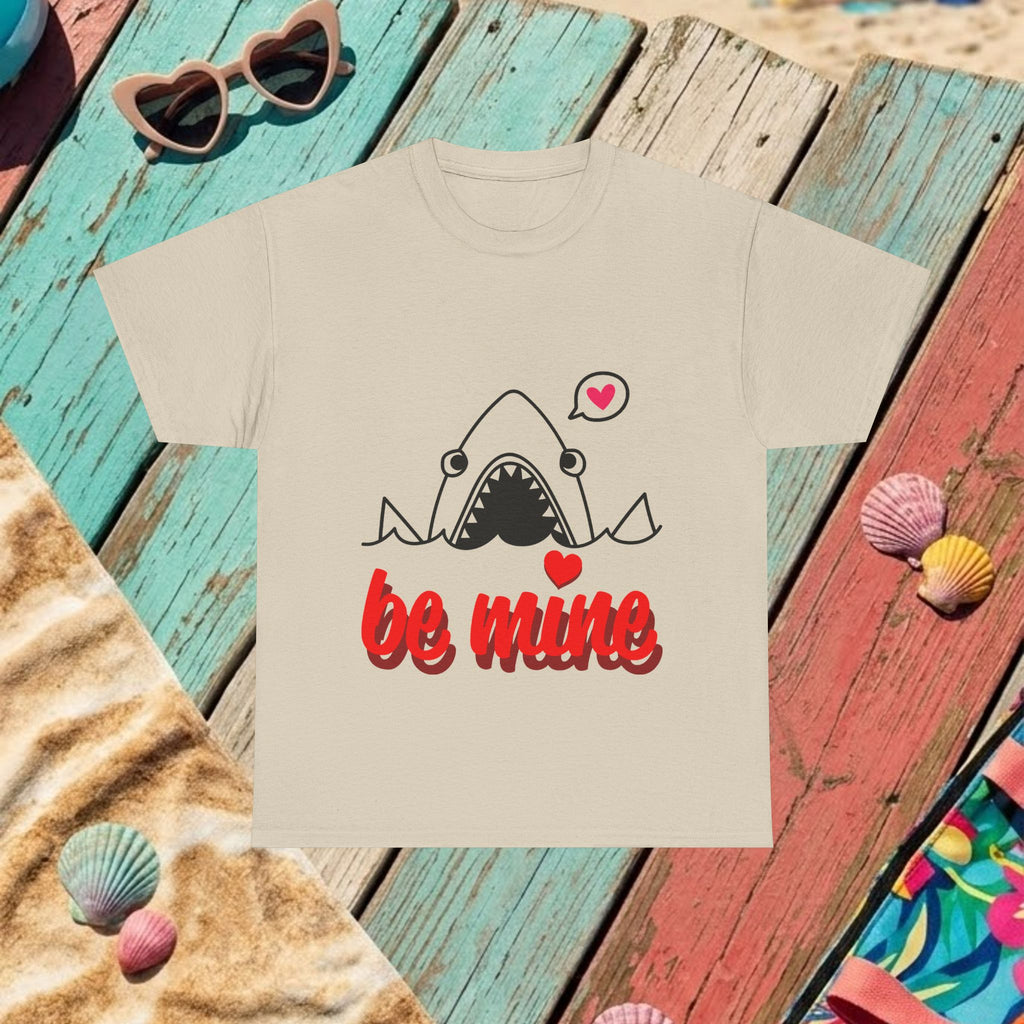 Beige T-shirt laid flat with shark graphic and red 'be mine' print