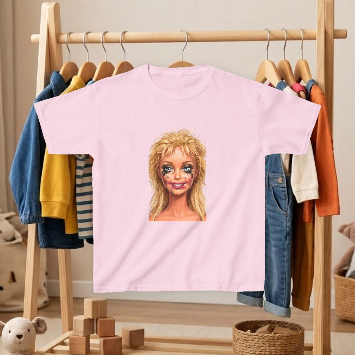 Kids' T-shirt in light pink with blonde doll portrait graphic on front