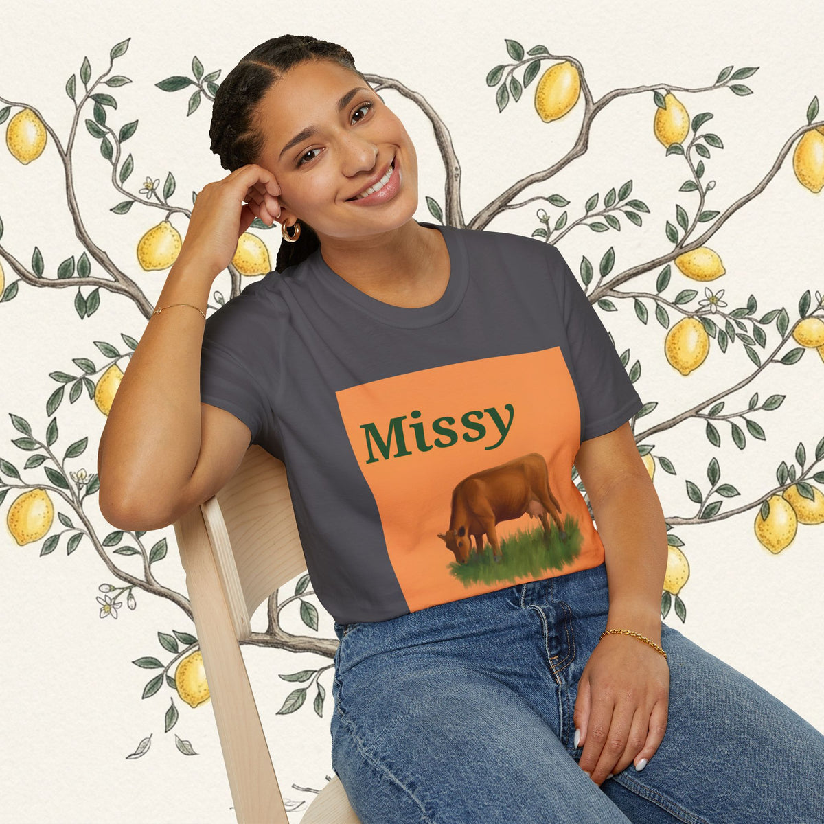 Dark gray cow graphic T-shirt with orange Missy panel and brown grazing cow