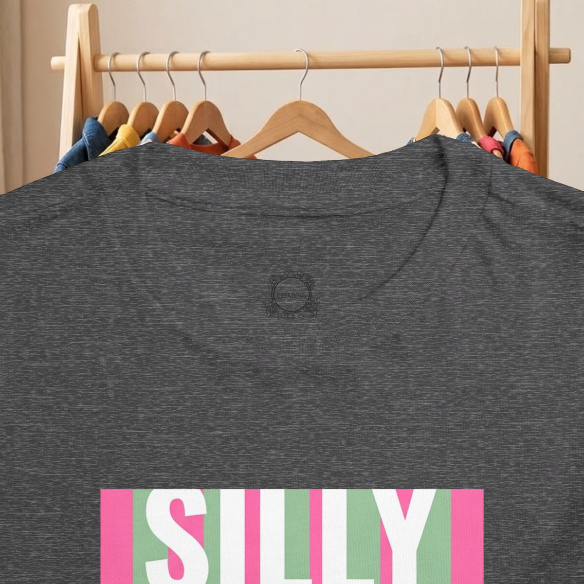 Toddler heather grey tee with partial “SILLY” colorful graphic print on front