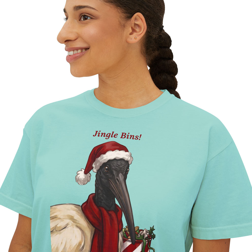 Chalky mint T-shirt close-up: “Jingle Bins!” text with crow wearing Santa hat