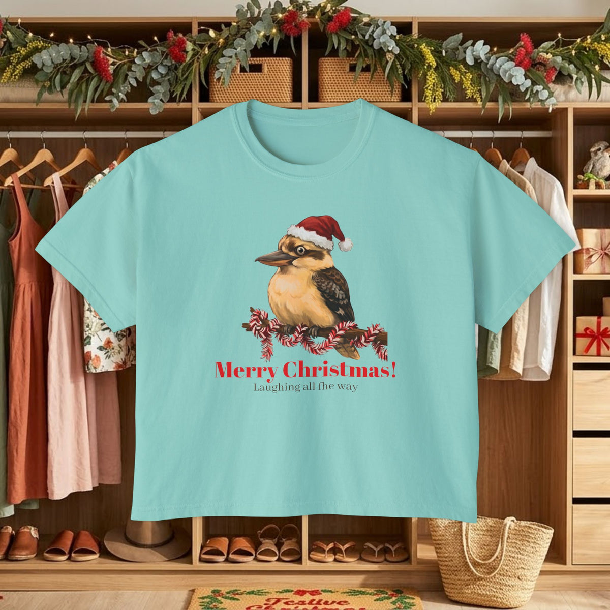 Teal graphic t-shirt with Santa-hat bird and “Merry Christmas!” front print