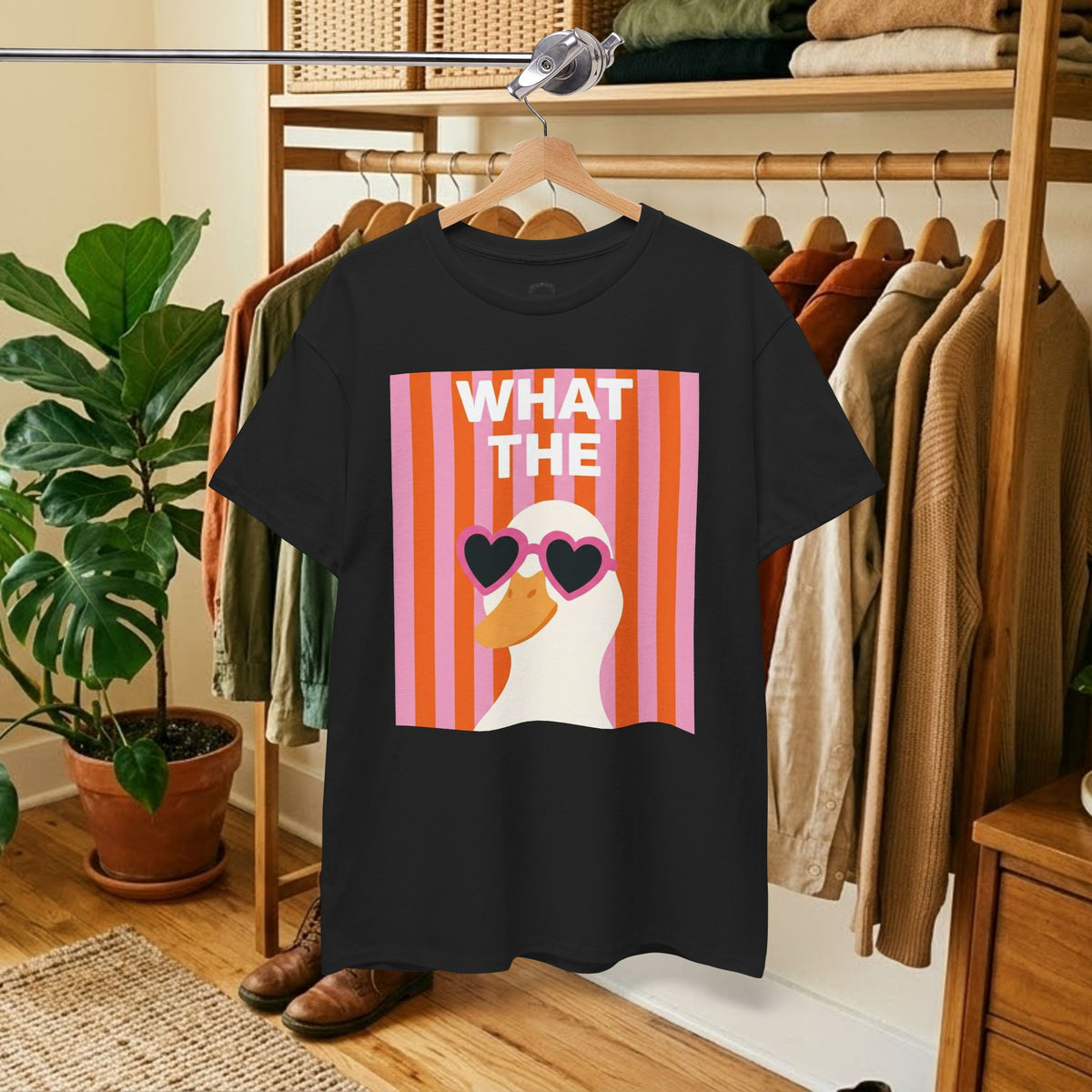 Black cotton graphic tee with 'WHAT THE' retro heart sunglasses print