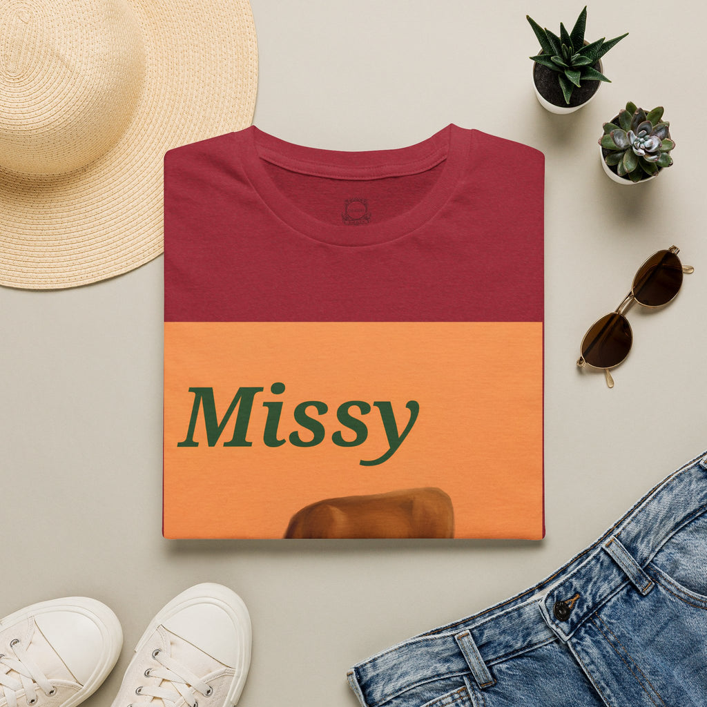 Maroon T-shirt with orange Missy graphic panel and brown cow grazing